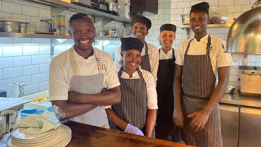 Former students working now at a fancy restaurant in the capital