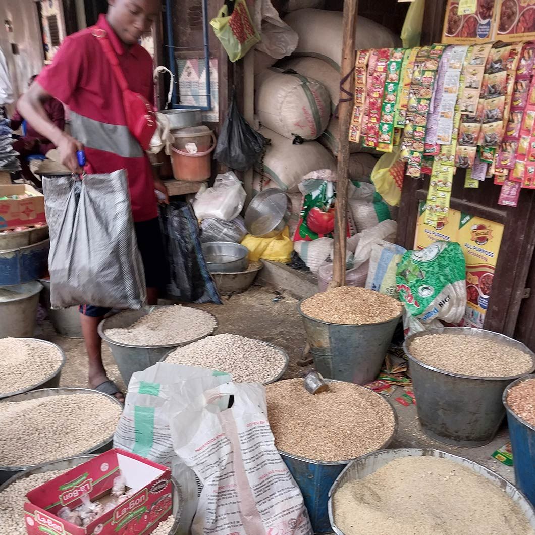 People buying grains in an Abuja market